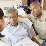 Doctor Talking To Senior Couple